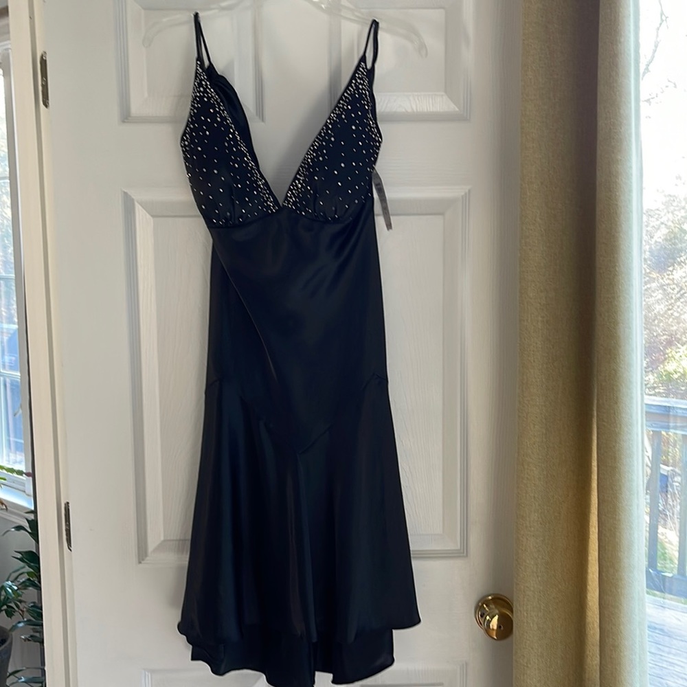 Beautiful black silk slip dress size 8 flairs at bottom studded at top